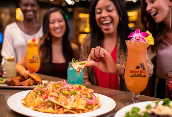 Group of Women Enjoying Nachos and Cocktails at Hard Rock Cafe